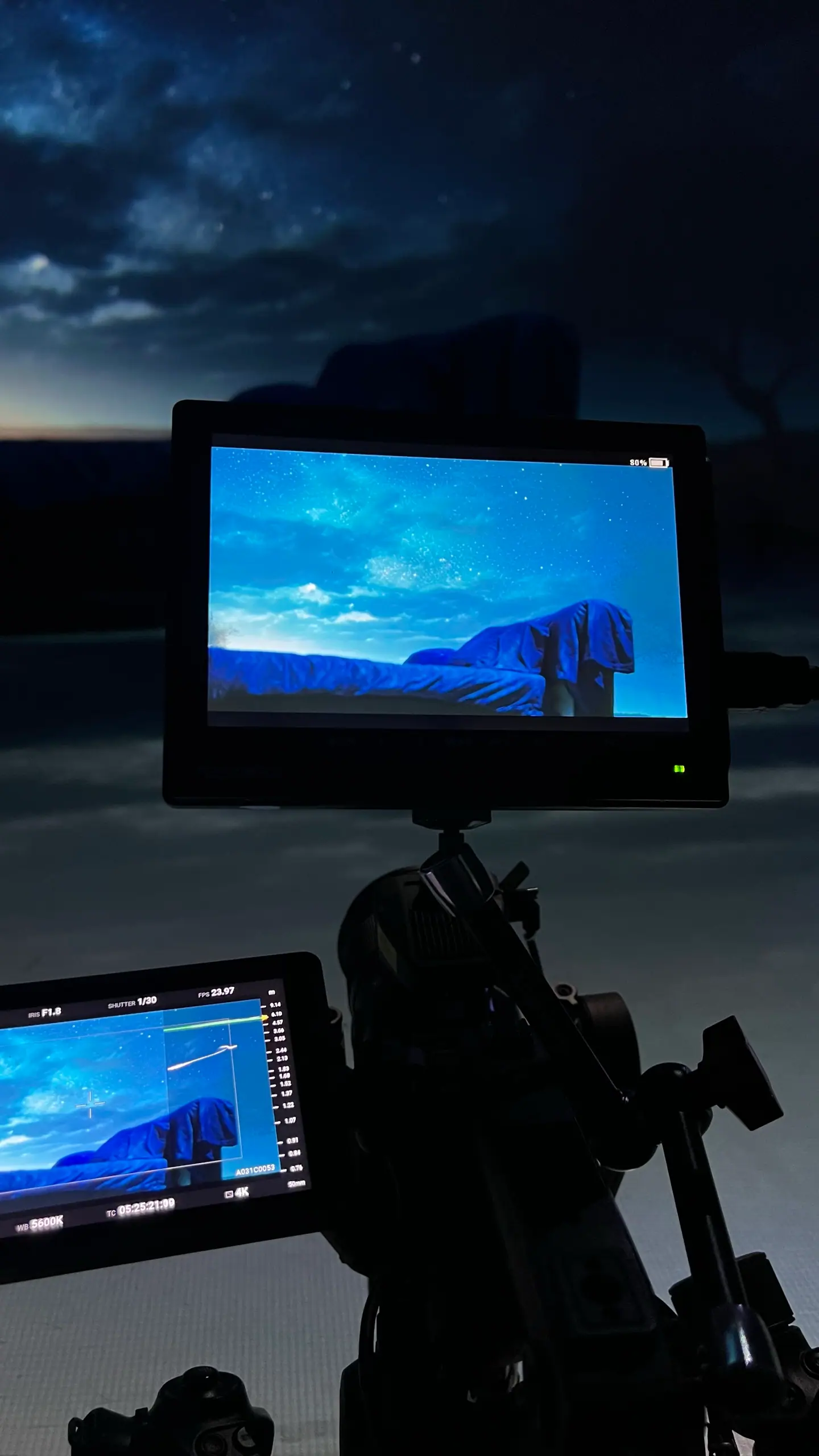 A monitor framing a night sky on the LED volume, a second monitor on the rig below
